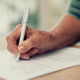 senior-adult-hand-signing-a-document-at-table-2026-03-25-06-00-03-utc_medium_thumbnail Putting together a Last Will - Allaire Elder Law